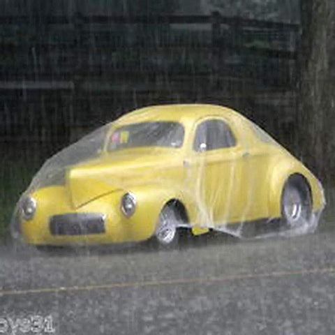 Vintage car covered by Universal Clear Car Cover For SUVs Sedans Sports Cars And Vintage Rides Up To 22 Feet By 12 Feet in rain