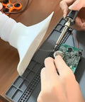 Heavy Duty Solder Fume Extractor With Adjustable Speed Knob And Three Stage Filtration Quiet Air Cleaner For Welding Grinding And Workshop Crews, used for soldering a circuit board.
