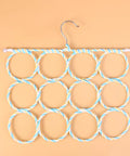 Paper Rattan Scarf Hanger With 12 Foldable Rings For Wardrobe And Closet Organization Keep Your Fits Tight With This Dope Hijab Holder And Tie Rack Zero Clutter Vibes Guaranteed, featuring twelve colorful rings on a hook.