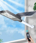 Rock Solid Solar Flood Lights With Motion Sensor And Pocket Remote Waterproof Outdoor Yard And Driveway Bulbs Quick Adjust Bracket Mount mounted on a wall with solar panel.