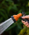 Heavy Duty Garden Hose Nozzle Sprayer 2 Pack With 10 Watering Patterns Built Tough Durable Hose Attachment For Yard Lawn Garden Care Adjustable Spray Comfortable Grip in use spraying water.