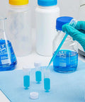 Close-up of Globe Scientific 5ml sterile polypropylene transport tubes with attached white caps and conical bottoms