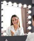 Woman applying makeup with Six Light Vanity Light Bar Dimmable Polished Chrome Boss Vibe for bathroom and vanity use