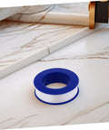 Heavy Duty PTFE Thread Seal Tape For Plumbing And Garden, 12 Rolls High Temperature Pipe Thread Tape on marble surface