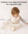 Toddler wearing Comfy 3 Pack Baby Sleep Sack For 6 To 12 Months 100 Percent Cotton 0.5 Tog Wearable Blanket For Infants with two-way zipper sitting on bed