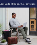Man using laptop outdoors with WiFi Mesh Extender For Eero 6 To Extend Coverage Up To 1500 Sq Ft With WiFi 6 Speeds