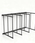 Industrial Grade Cardboard Box Organizer And Vertical Carton Storage Rack For Art Canvases Office Supplies Warehouse Packaging With Dead Simple Tool Free Setup, black metal frame with shelves.