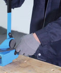 Throatless Rotary Hand Shear For Sheet Metal 16 Gauge 1.5 mm Capacity Easy Cut For Straight Curved And Internal Corner Cuts Mini Benchtop Tool Blue Finish Heavy Duty Shop Essential For Mild Steel shown in use on benchtop