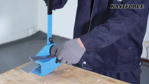 Throatless Rotary Hand Shear For Sheet Metal 16 Gauge 1.5 mm Capacity Easy Cut For Straight Curved And Internal Corner Cuts Mini Benchtop Tool Blue Finish Heavy Duty Shop Essential For Mild Steel shown in use on benchtop