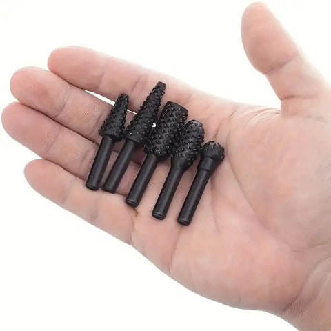 Five Piece Rotary Burr Set For Woodworking Metal Carving And Polishing With One Quarter Inch Shank in hand