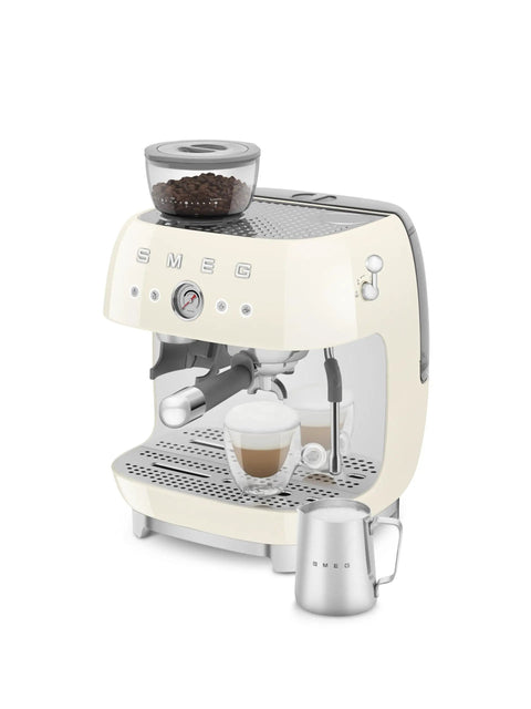 Top Shelf Semi Automatic Espresso Machine With Built In Conical Burr Grinder Dual Thermoblock Heating Precision Controls And Authentic 1950s Retro Vibe In Smooth Cream Finish with coffee beans on top.