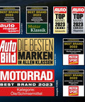 Collage of automotive brand awards from magazines like Auto Bild and Motorrad, dated 2022 and 2023.