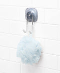 Suction Shower Hook For Loofahs Towels And Razors, No Drill Bathroom Organizer with a blue loofah on white tiles