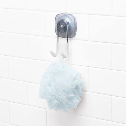 Suction Shower Hook For Loofahs Towels And Razors, No Drill Bathroom Organizer with a blue loofah on white tiles
