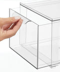 Hand pulling drawer of Stackable Closet Organizer Bin With Pull Out Drawer For Shoes Clothes Bags And More In Clear Plastic Lumiere Collection 2 Pack Built For Easy Closet Storage And Quick Access