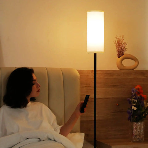 Tall Minimalist Floor Lamp for Living Room and Office with White Fabric Lampshade near bed