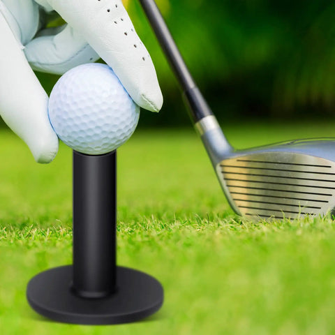 Close-up of a golf ball on black rubber tee from Rubber Golf Tees Set With Holders, Five Height Sizes for practice, on grass with club.
