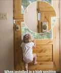 Childproof security latch installed on wooden door, preventing toddler from reaching the handle.