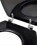 Close-up of chrome hinge on black toilet seat, showcasing the high-quality design of Straight Up Comfy Flannel Toilet Seat Covers With Lids Two Pack Seamless Slide On Design Heavy Duty Water Resistant Black For Most Round Bowls Zero Hassle Mount Clean Slick Vibe.