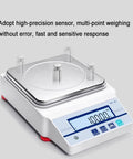 Heavy Duty Electronic Hydrostatic Balance Scale With Crisp Lcd Panel And Sturdy Metal Tray Built Legit For Dead On Precise Density And Volume Testing Up To Five KG Capacity, featuring stainless steel tray and LCD display.