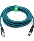 M12 Ethernet 8 Pin X Code To RJ45 CAT 7e GigE Cable 1 meter long, teal color, coiled with connectors shown.