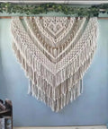 Macrame wall hanging made with 4mm Natural Cotton Macrame Rope Twisted 3-Strand Cord, 328 Yards, displayed on a wooden dowel.