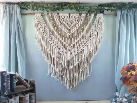 Macrame wall hanging made with 4mm Natural Cotton Macrame Rope Twisted 3-Strand Cord, 328 Yards, displayed on a wooden dowel.