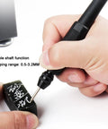 Hand using a flexible shaft tool with clamping range 0.5-3.2MM for precise engraving on a small stone.