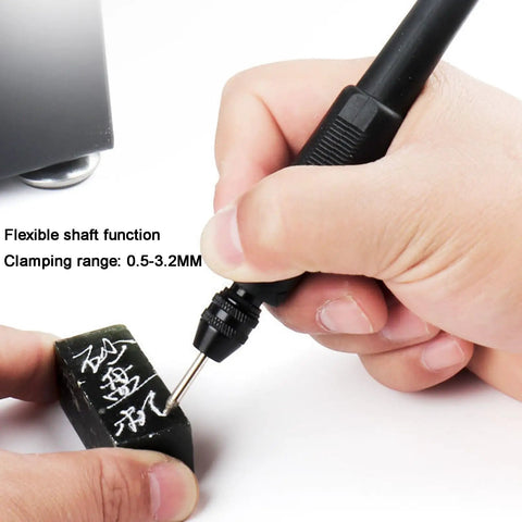 Hand using a flexible shaft tool with clamping range 0.5-3.2MM for precise engraving on a small stone.