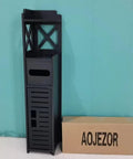 Slim Toilet Paper Storage Cabinet For Tiny Bathrooms, 29.9 Inch Tall, black with X-frame and door, next to box against wall.