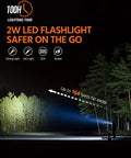 2W LED flashlight beam illuminating forest in image for 42800mAh Solar Charger Power Bank Portable Charger With USB C Input Output
