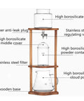 Top Shelf Cold Brew Coffee Maker With Clear Glass Carafe And Sturdy Wood Base Stainless Steel Drip Valve showing components labeled.