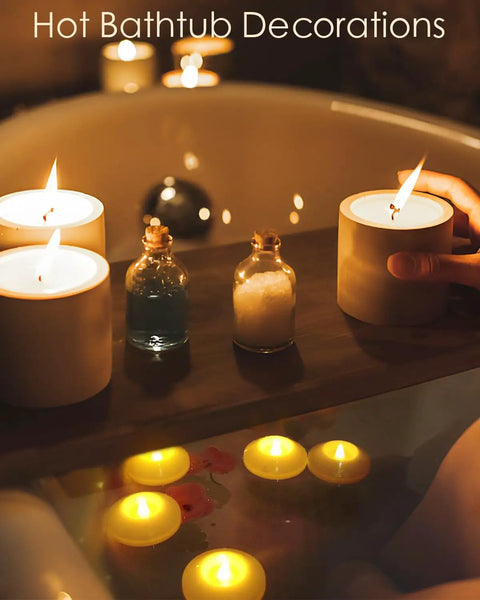 12 Pack LED Floating Candles 3 Inch Flameless Plastic Tea Lights For Bathtub Pool And Vase Centerpiece Waterproof And Water Activated Warm White Glow Battery Replaceable And Reusable Lit Ambient Glow in a bathtub setting.