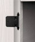 Matte Black Overlay Cabinet Door Hinges Set For Half Inch Overlay SelfClosing Hardware For Kitchen Cabinets Cupboards And Furniture Doors 50 Pieces 25 Pairs attached to a white cupboard door.