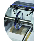 Close-up of Automatic Edge Grinding Machine For Eyewear With Scanner And 7 Inch Touch Screen showing lens on grinding spindle.