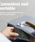 Hand holding portable Rock Solid 18W DC UPS Power Backup, compact size fits easily in bags for routers and PoE cameras.