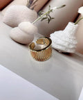 Fresh Vintage Wide Cuff Open Ring For Women Featuring A Bold Hollow Geometric Grid And Striped Texture, on a styled surface.