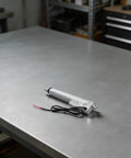 12V Electric Linear Actuator With Straight Push Pull Rod For Heavy Duty Industrial Automation And Sofa Lifts IP65 waterproof on a metal table.