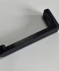 Beefy Wall Mount Tape Dispenser Rack Rustproof Smooth Install Adhesive Tool Holder Organizer in black, angled view, sturdy design.