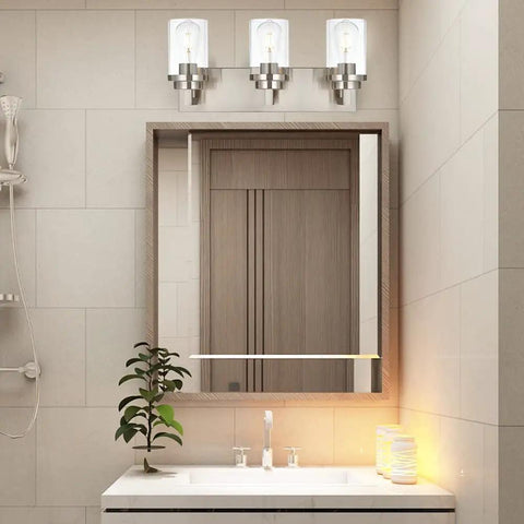 Three Light Vanity Light Fixture In Brushed Nickel With Clear Glass Shades For Modern Bathrooms above mirror setup