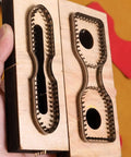 2 Piece Strap End Cutting Mold Set With Wooden Dies And Japanese Steel Cutters in hand, front view