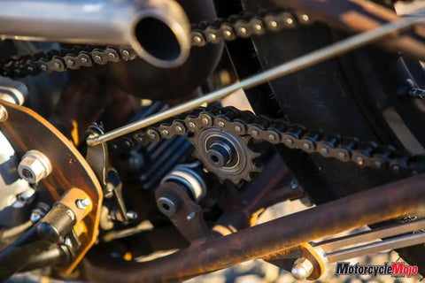 Solid Badass Weld On Motorcycle Chain Tensioner Compatible With 530 Sprockets For Custom Chopper Bobber And Cafe Racer Mods close-up showing chain and sprocket.