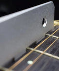 Close-up of Adjustable Notched Guitar Neck Straight Edge Tool for Fretboard Alignment on guitar neck.