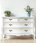 White dresser with Vintage Style Leaf Drawer Pulls for Cabinets and Dressers in Bronze Finish Premium Zinc Alloy Handles, two plants on top