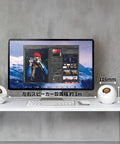USB Powered Desk Speaker System With 4.4W Output, 45 Degree Upward Driver on white desk next to computer monitor.