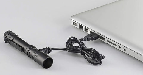 MacroStream USB Rechargeable EDC Flashlight With 500 Lumens And 2000 Candela Compact Pocketable LED Light charging via laptop USB cable