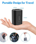 Portable Cordless Vacuum Seal Pump With Strong Electric Suction For Fast Bag Compression shown in hand, compact black design for travel.