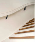 Heavy Duty Zinc Alloy Stair Brackets Matte Black Handrail Support 5 Pack on curved wall above wooden stairs
