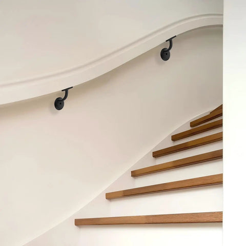 Heavy Duty Zinc Alloy Stair Brackets Matte Black Handrail Support 5 Pack on curved wall above wooden stairs