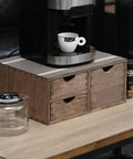 Coffee Pods Storage Drawer Organizer For K Cups And Capsules For Coffee Maker Dual Compartment Desk Drawer With Detachable Partition Fits Small And Large Pods Kitchen Counter Box Dark Wood Mini Chest Your Caffeine Fix displayed on a wooden table with a coffee maker and cup on top.